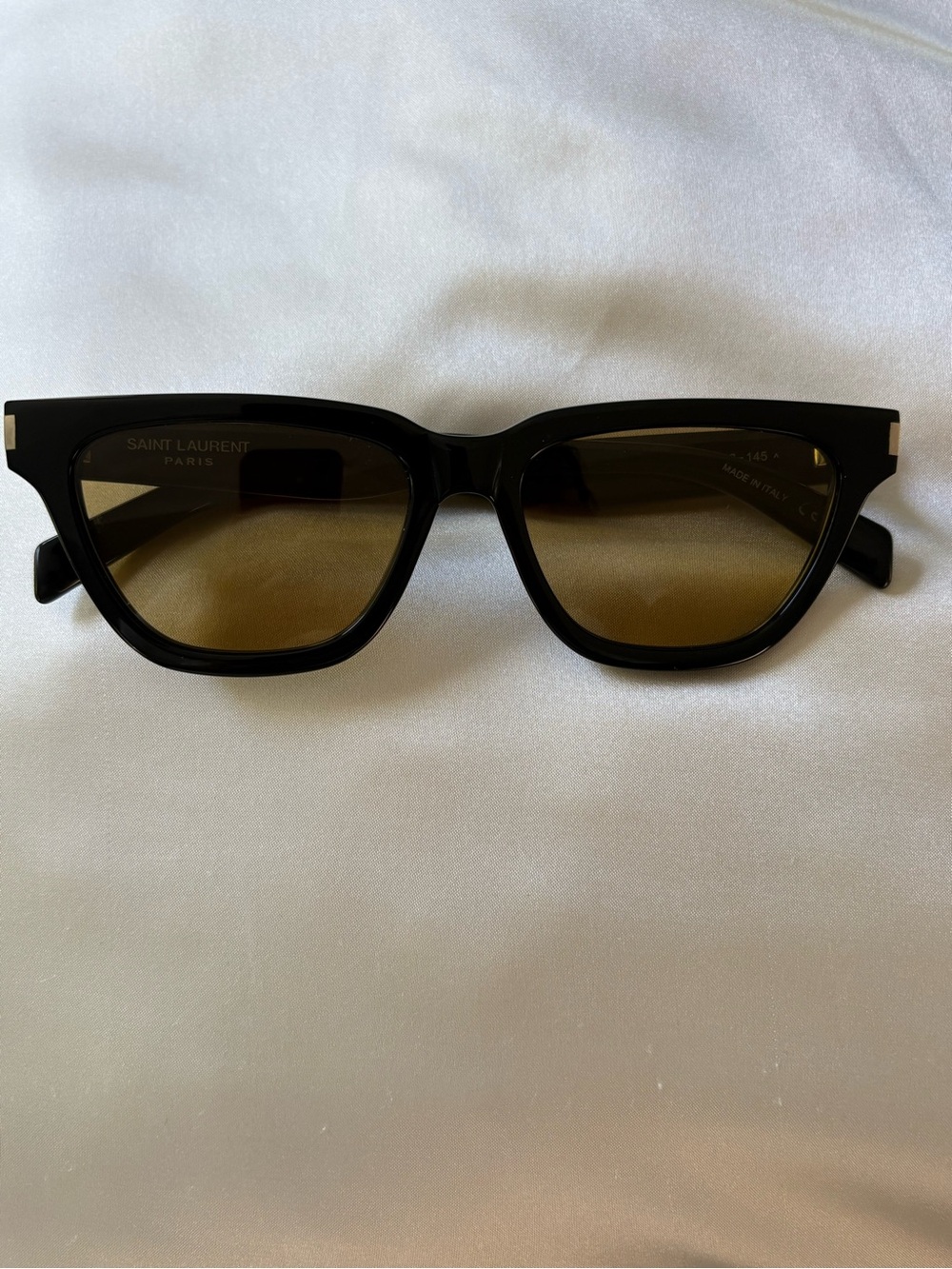 Saint Laurent women’s Black Frame Sunglasses with Brown Lenses